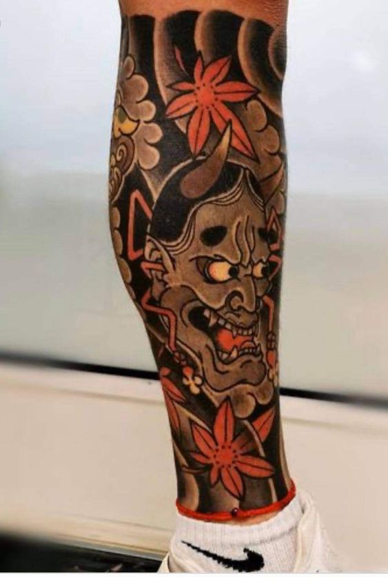 tattoo mặt quỷ nhật cổ bắp chân