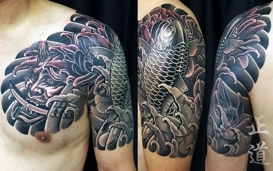 tatoo cá chép bắp tay kết hợp mặt quỷ qua ngực