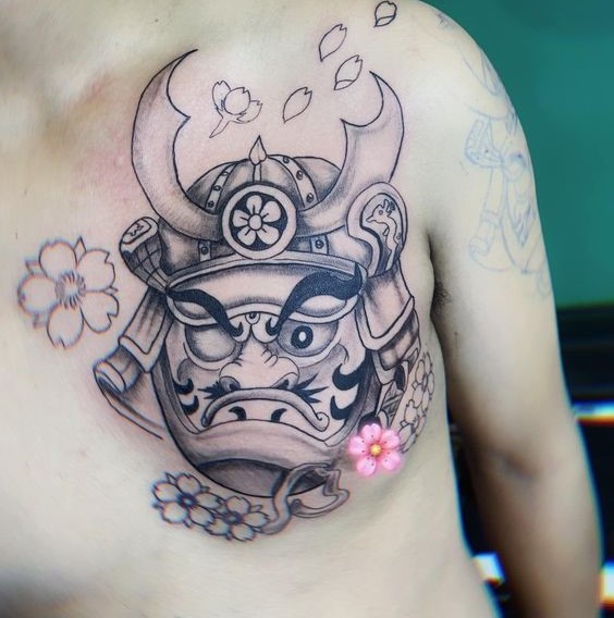 kiểu xăm hình daruma một mắt kết hợp hoa anh đào biểu trưng cho sự quyết tâm