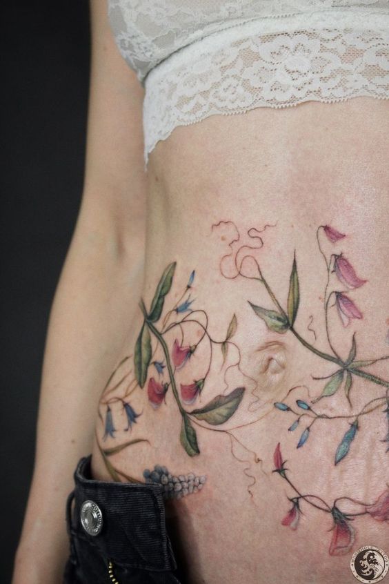 hình xăm che vết rạn bụng cực đẹp