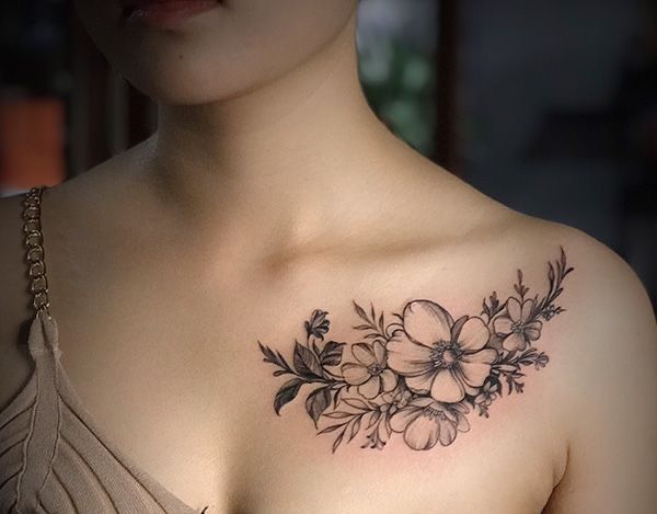 tattoo hoa đào trên xương quai xanh