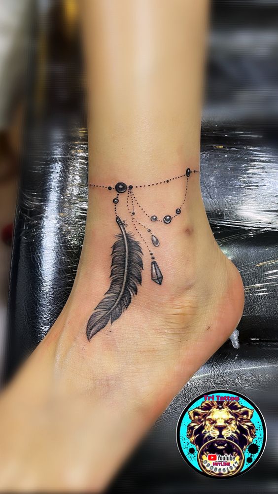 tattoo rung lắc chân kèm cặp lông vũ siêu đẹp