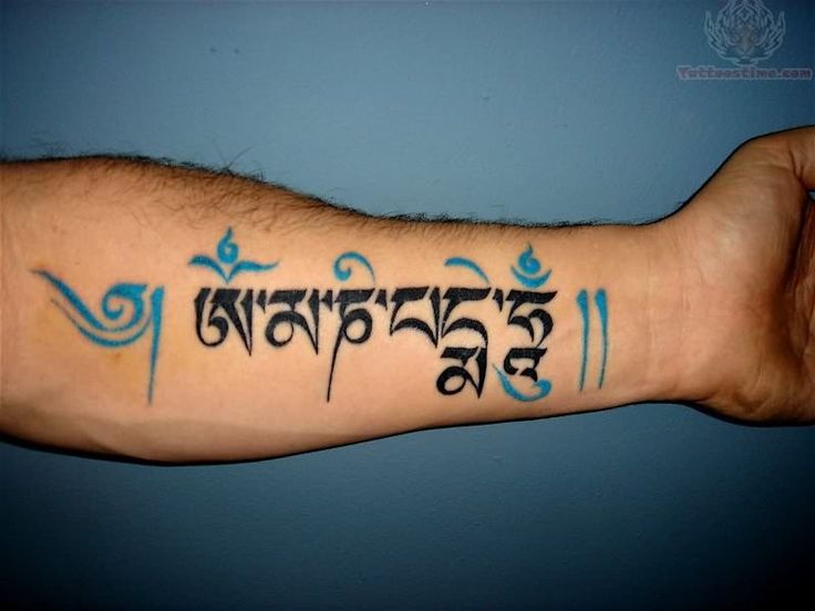 mẫu tattoo chữ phạn ở cẳng tay